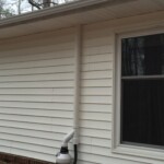 Picture of a house with a radon system on it.